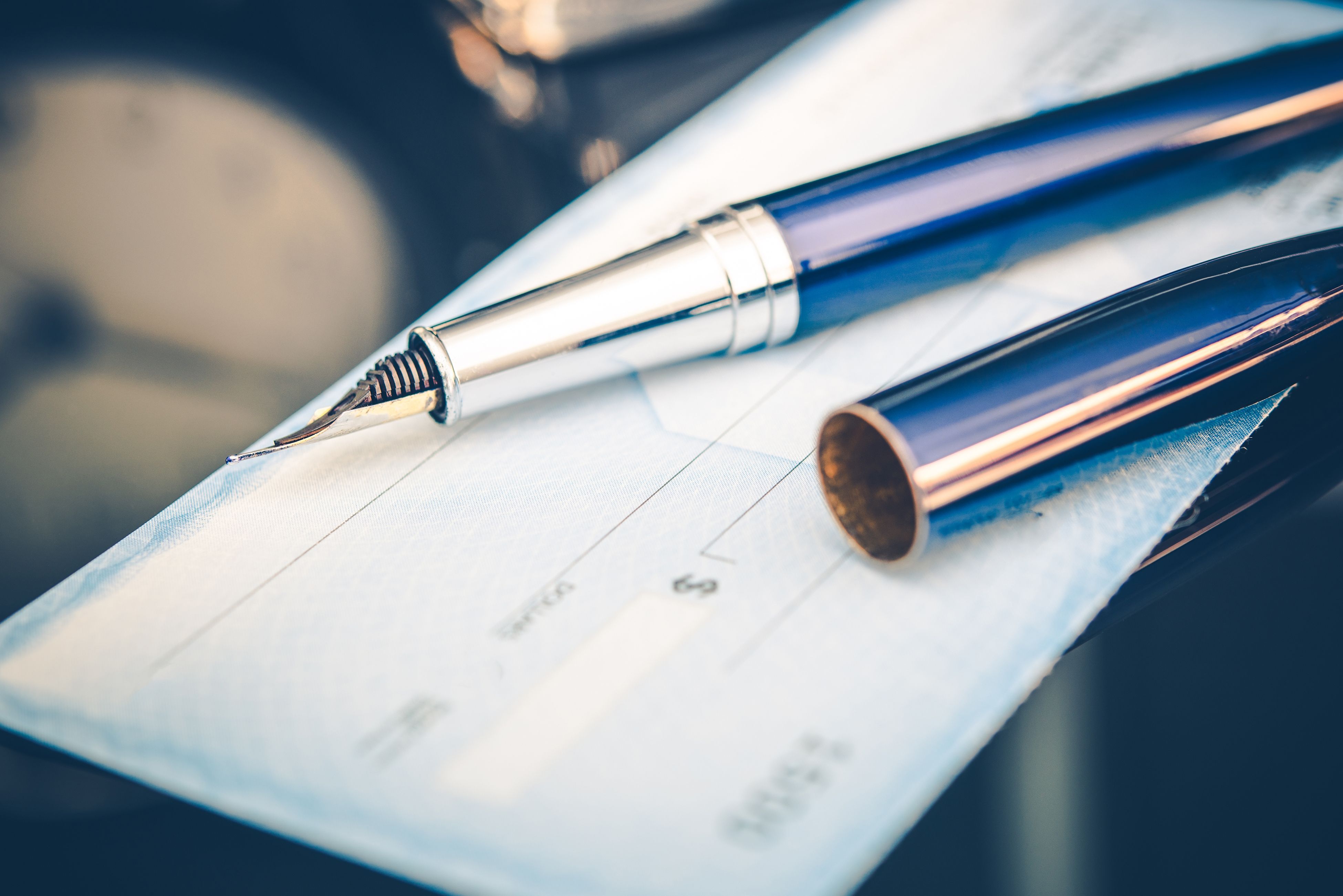 Issuing payment by check by using a fountain pen