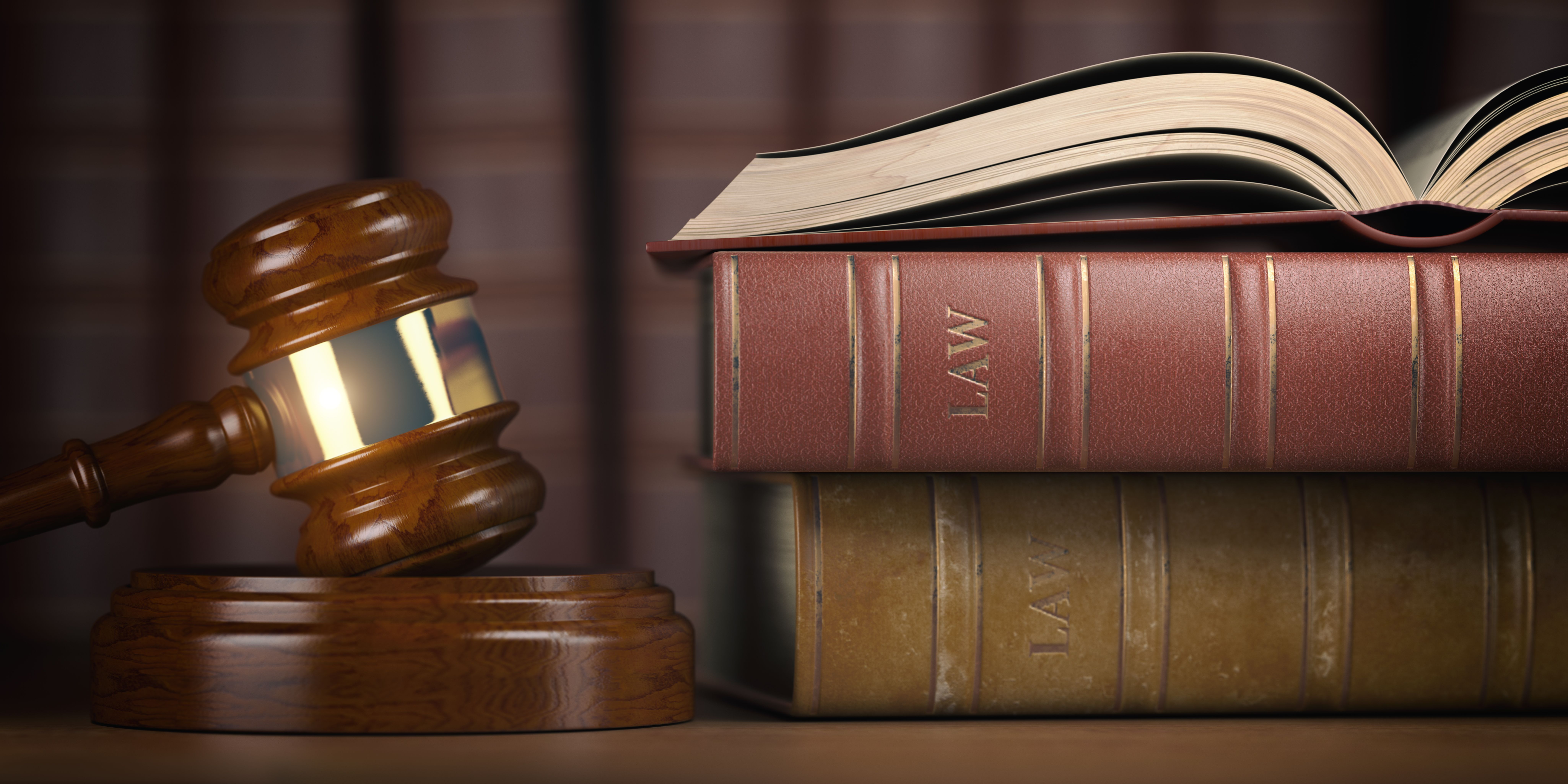 A judge gavel beside some law books