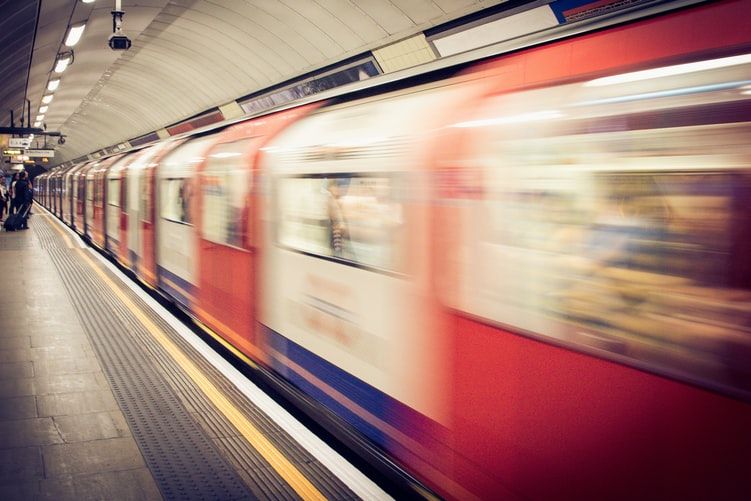 timelapse photo of a train in underground