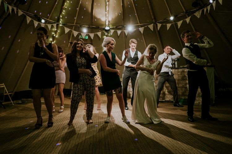 a group of people dancing in a room