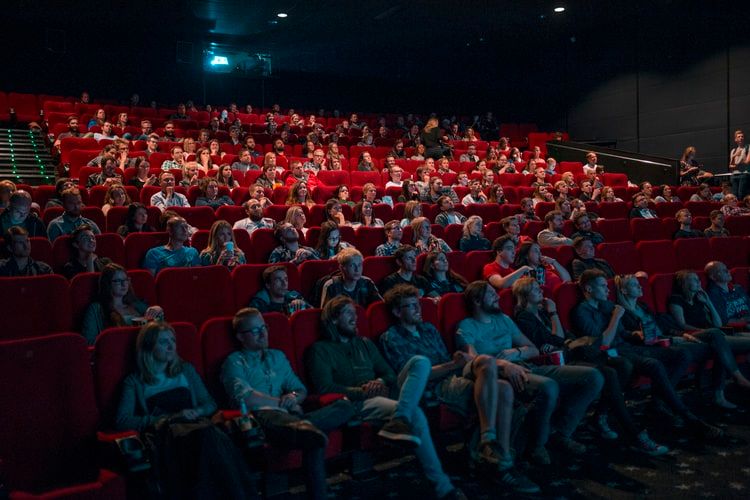 people watching movie in a cinema