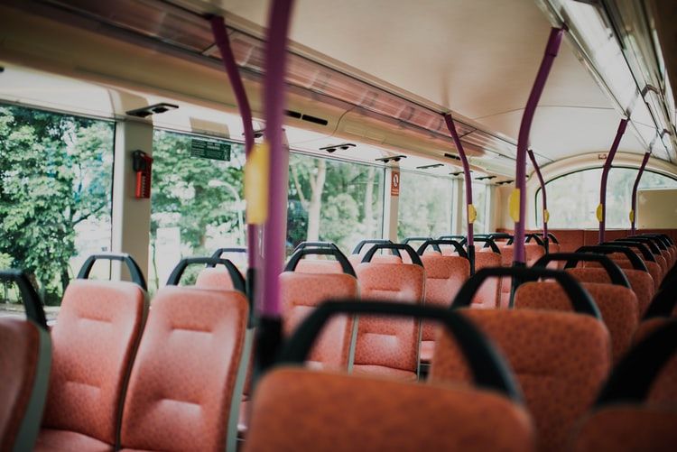 orange vehicle seat inside a bus