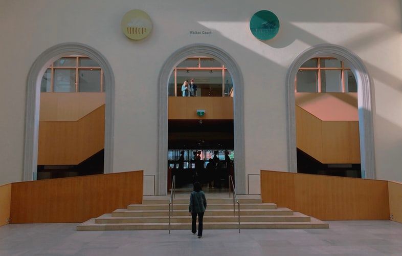 a man standing outside a museum