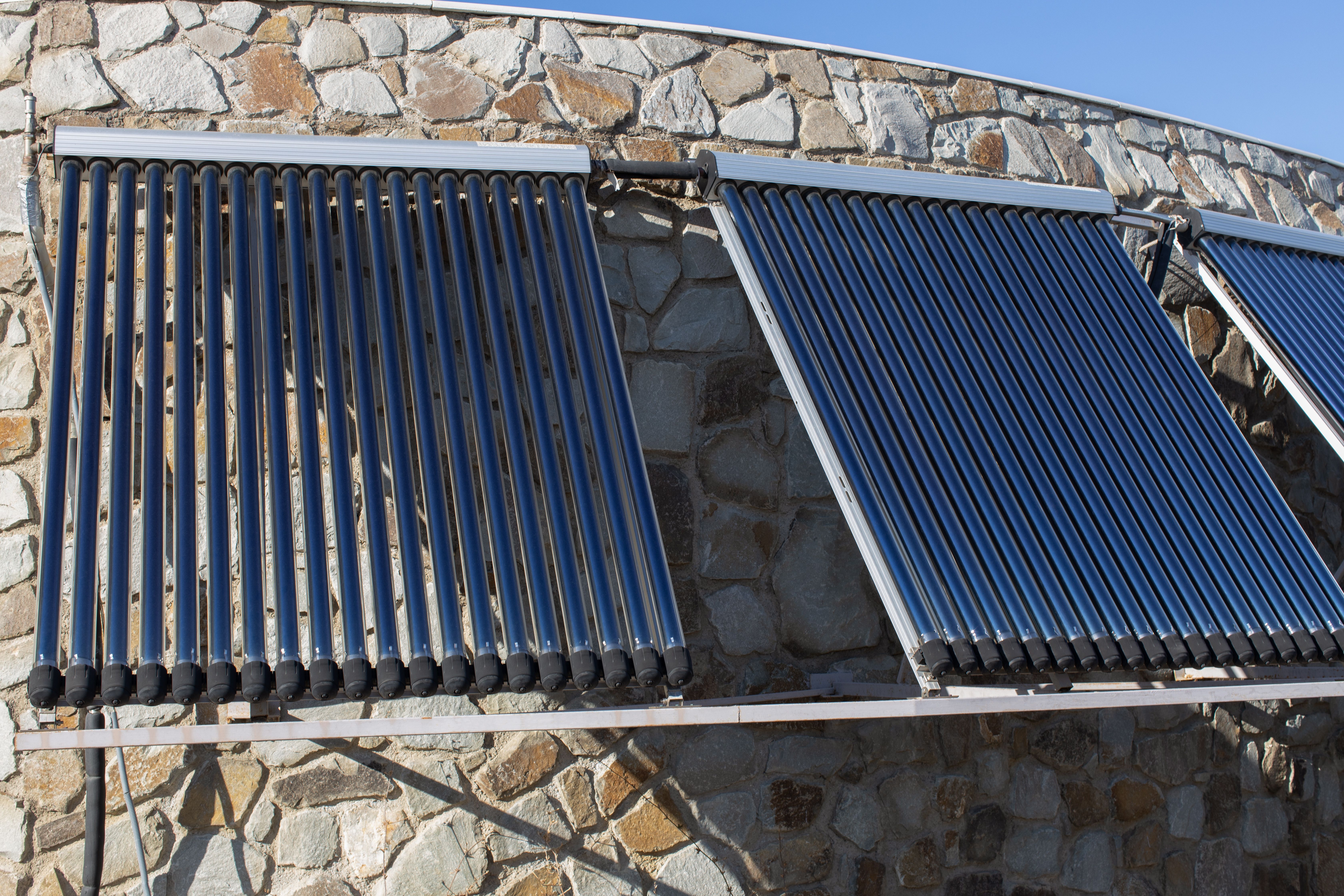 Solar water heating system installed on the roof of a house