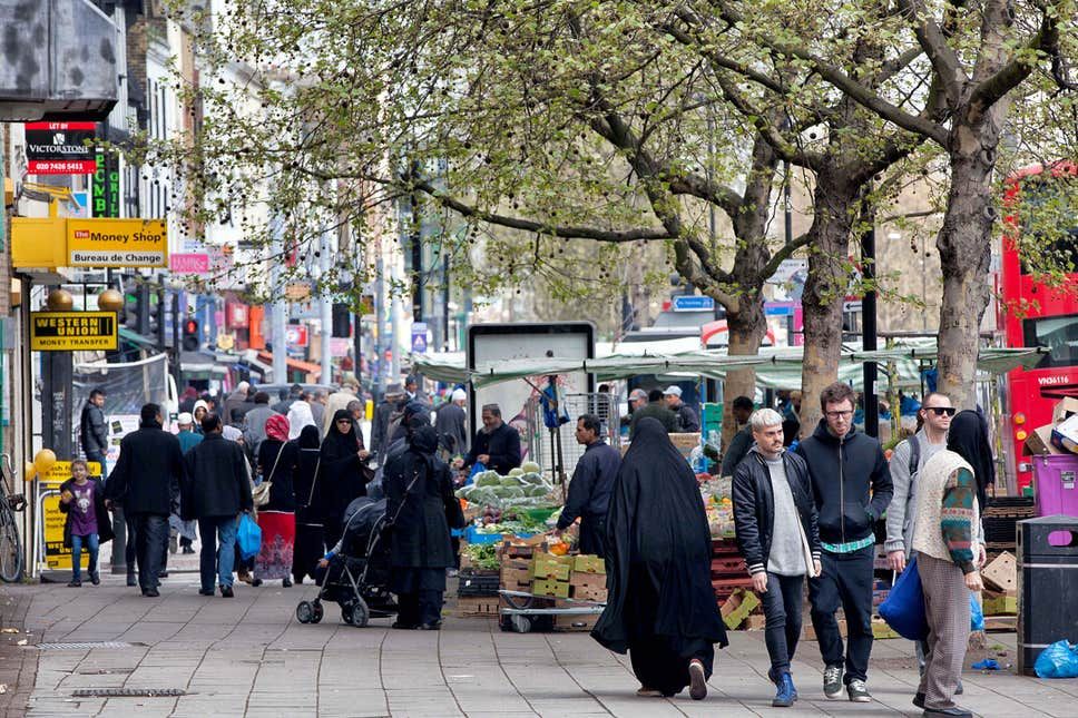 a lot of people on the street in Tower Hamlets