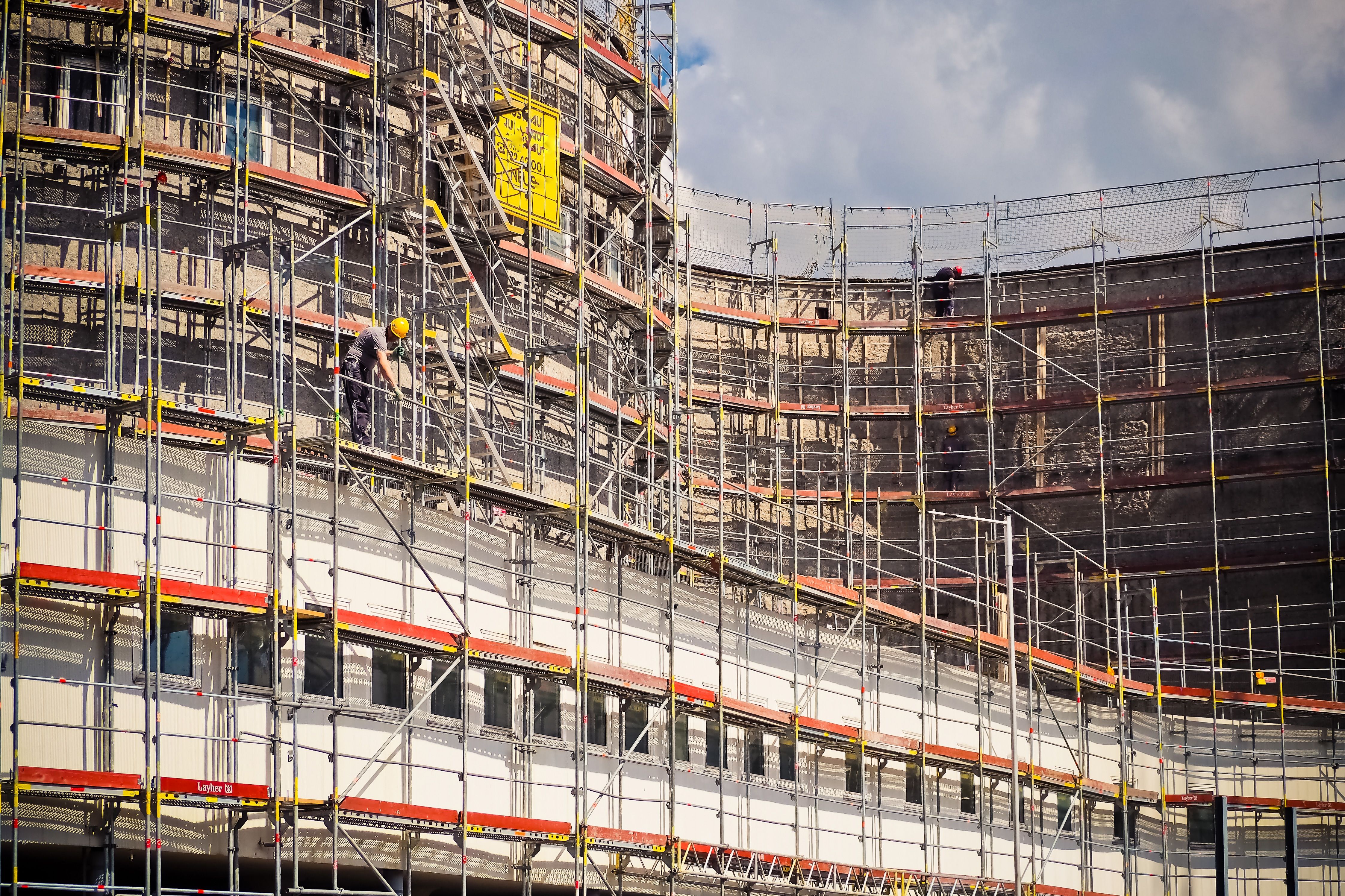 A big scaffold system outside a Build To Rent development being constructed with financial support from the UK government to solve the housing crisis.