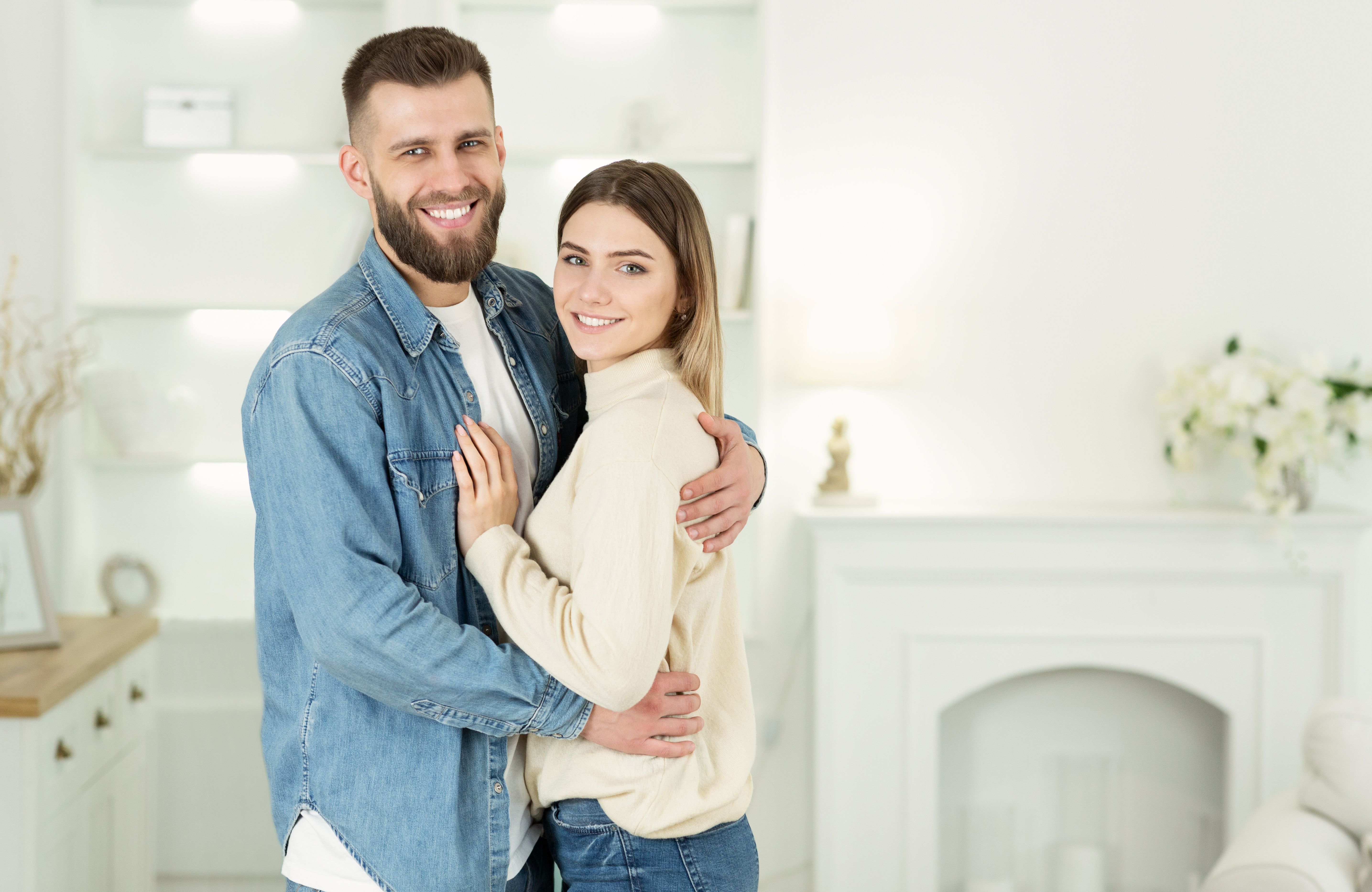 A young couple just moved into their new home at a Build To Rent development after paying their rent in advance.