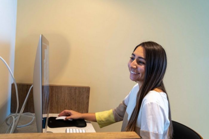 smiling lady checking setmore appointments