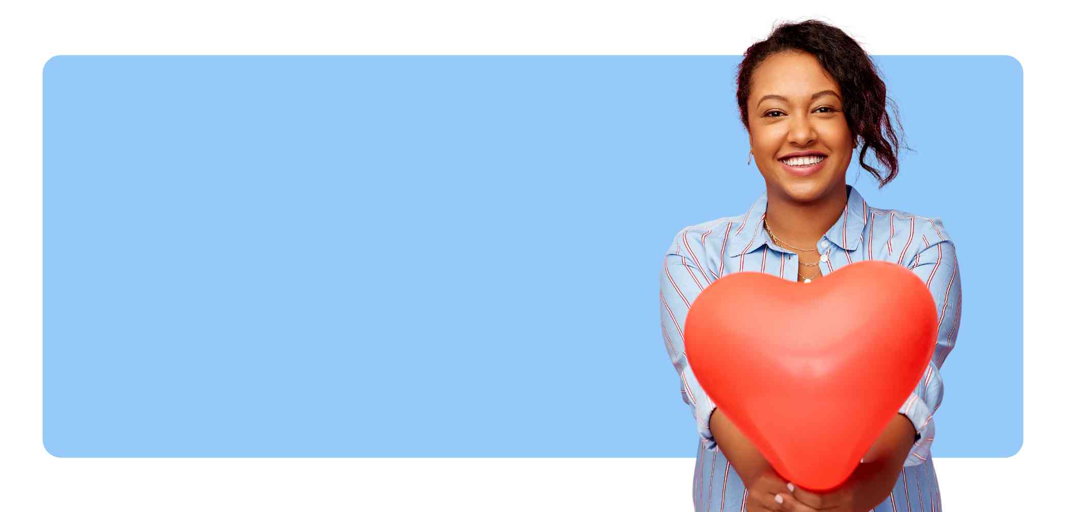 girl holding heart balloon