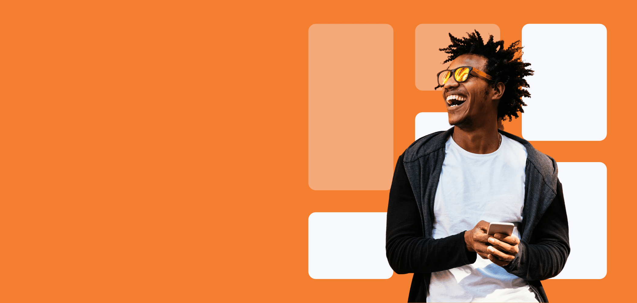 man smiling with mobile phone