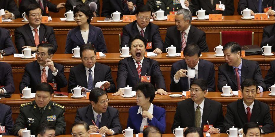 1160935_delegates-sit-at-stage-before-opening-ceremony-of-18th-national-congress-of-communist-party-of-china-at-great-hall-of-people-in-beijing