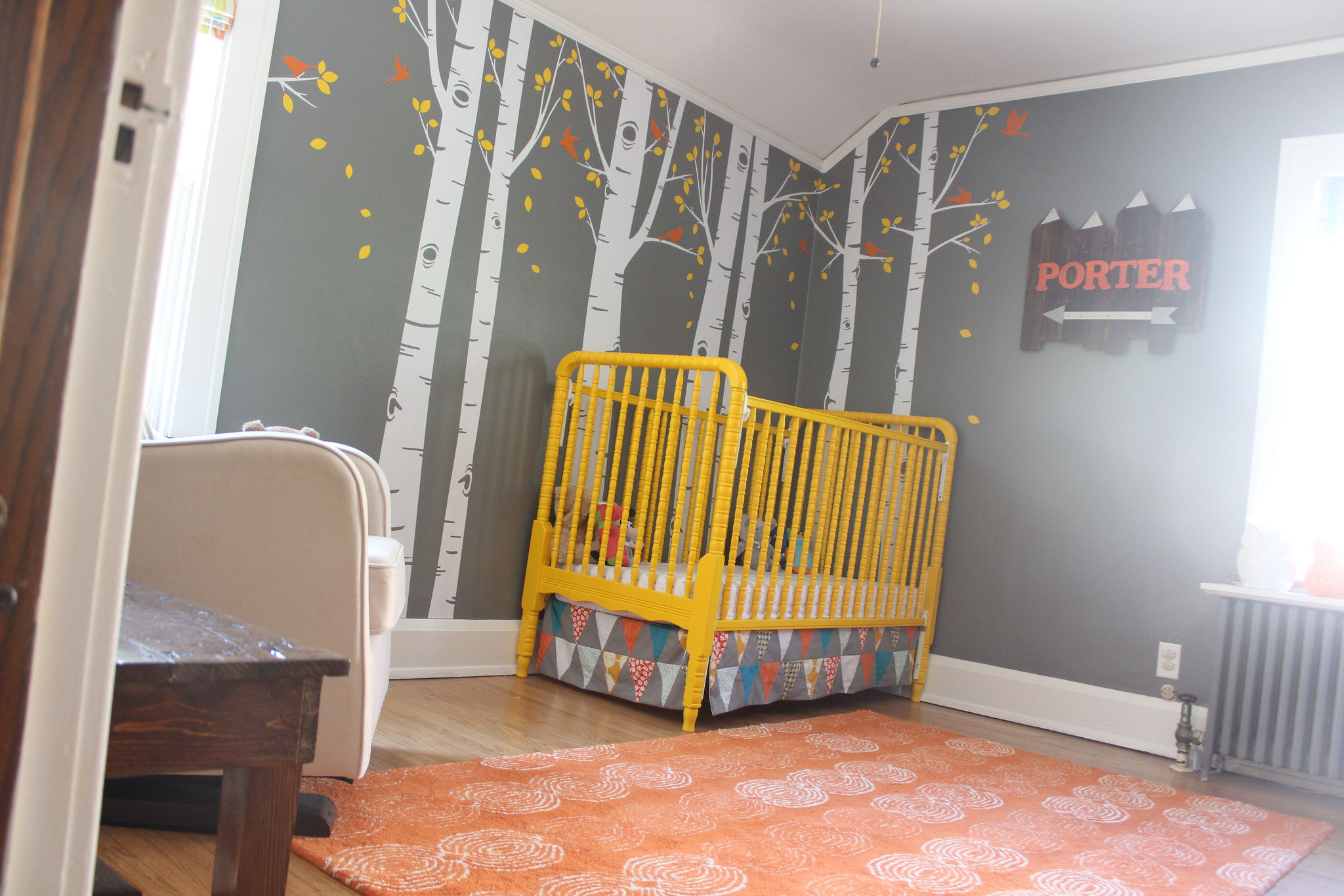 Painted Yellow Crib in this Woodland Theme Nursery