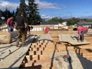 Volunteers for Habitat for Humanity working on a build