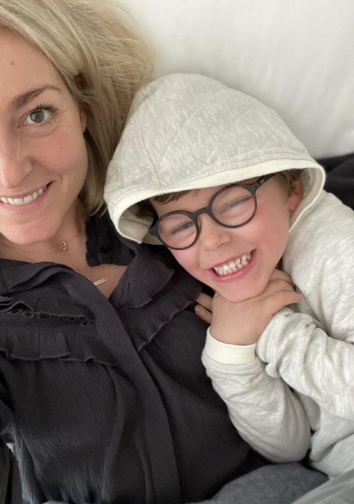 A mom and son cuddling.