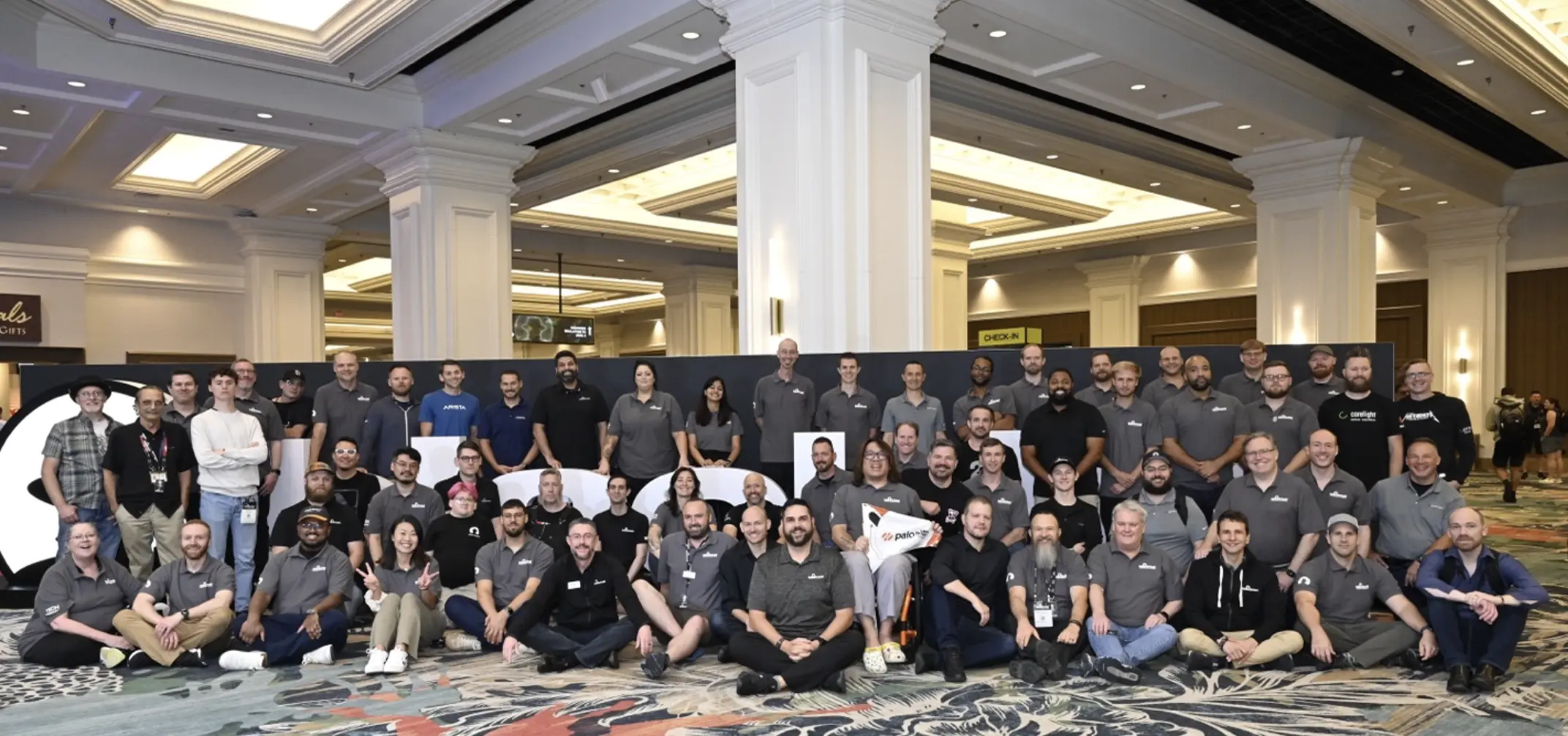 The Black Hat team poses together in the conference center lobby