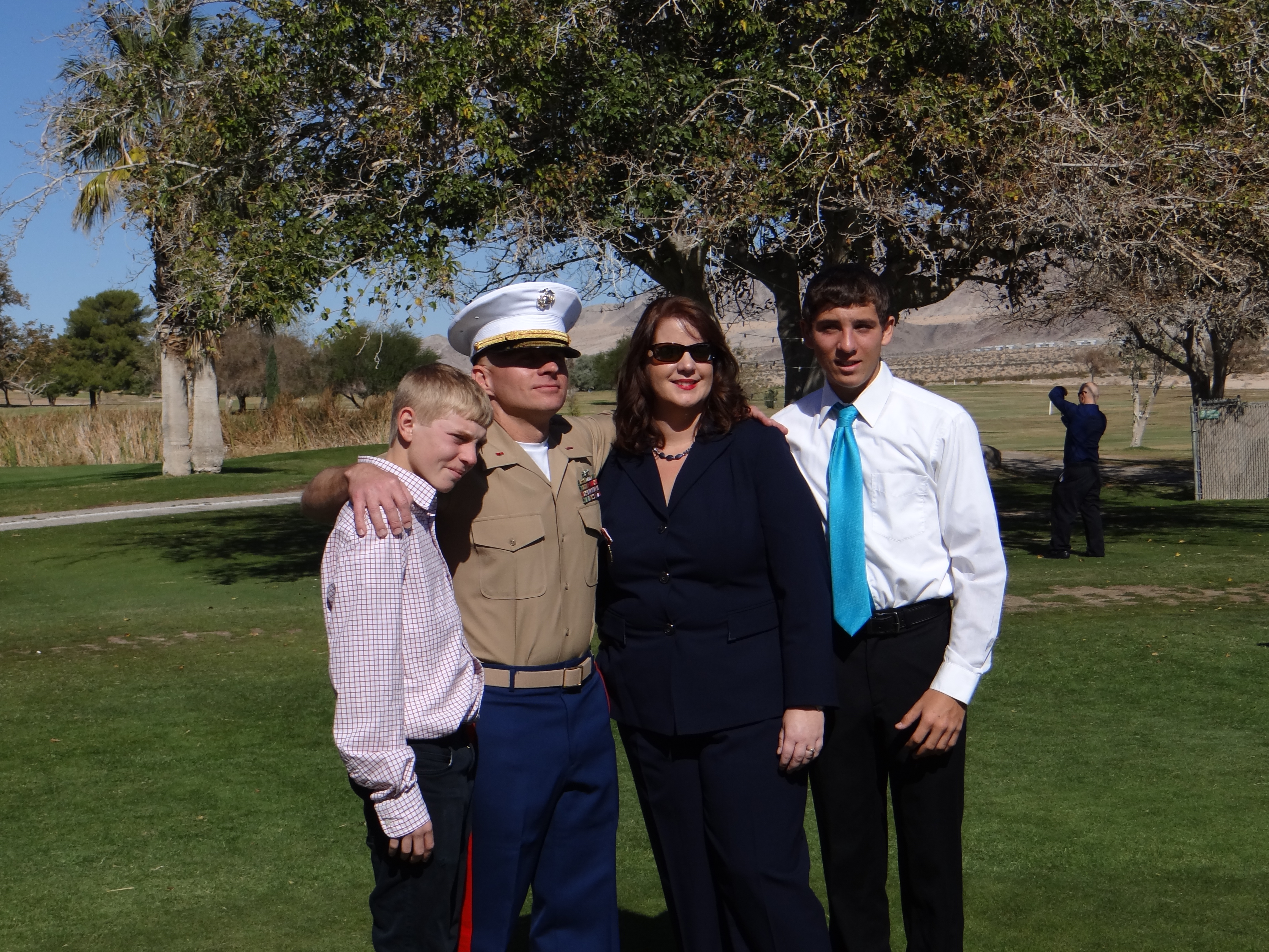 John in uniform with family.
