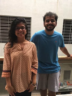 Radhika and her cousin on a balcony.