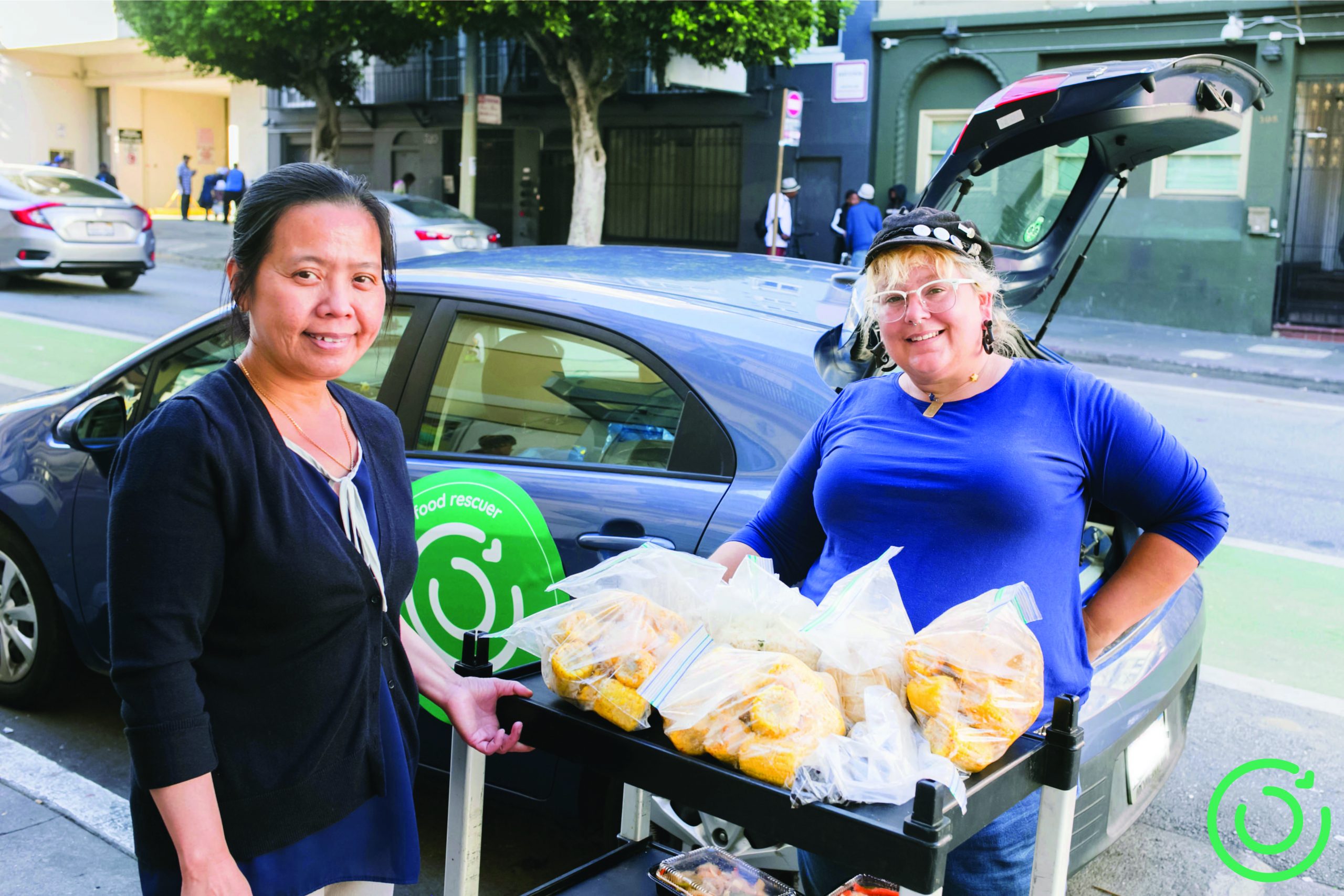 Food rescuers drop off donated food to a senior center