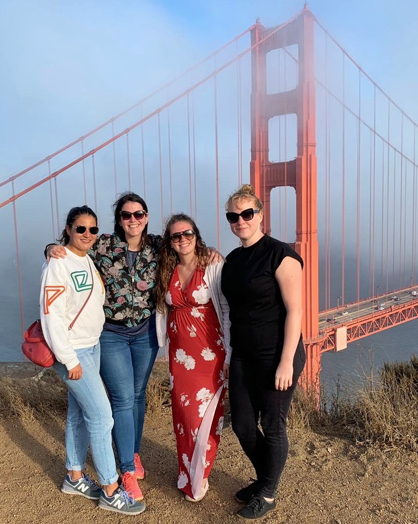 Silke, Jenny, and two colleagues in front of the Golden Gate Bridge in San Francisco, California.