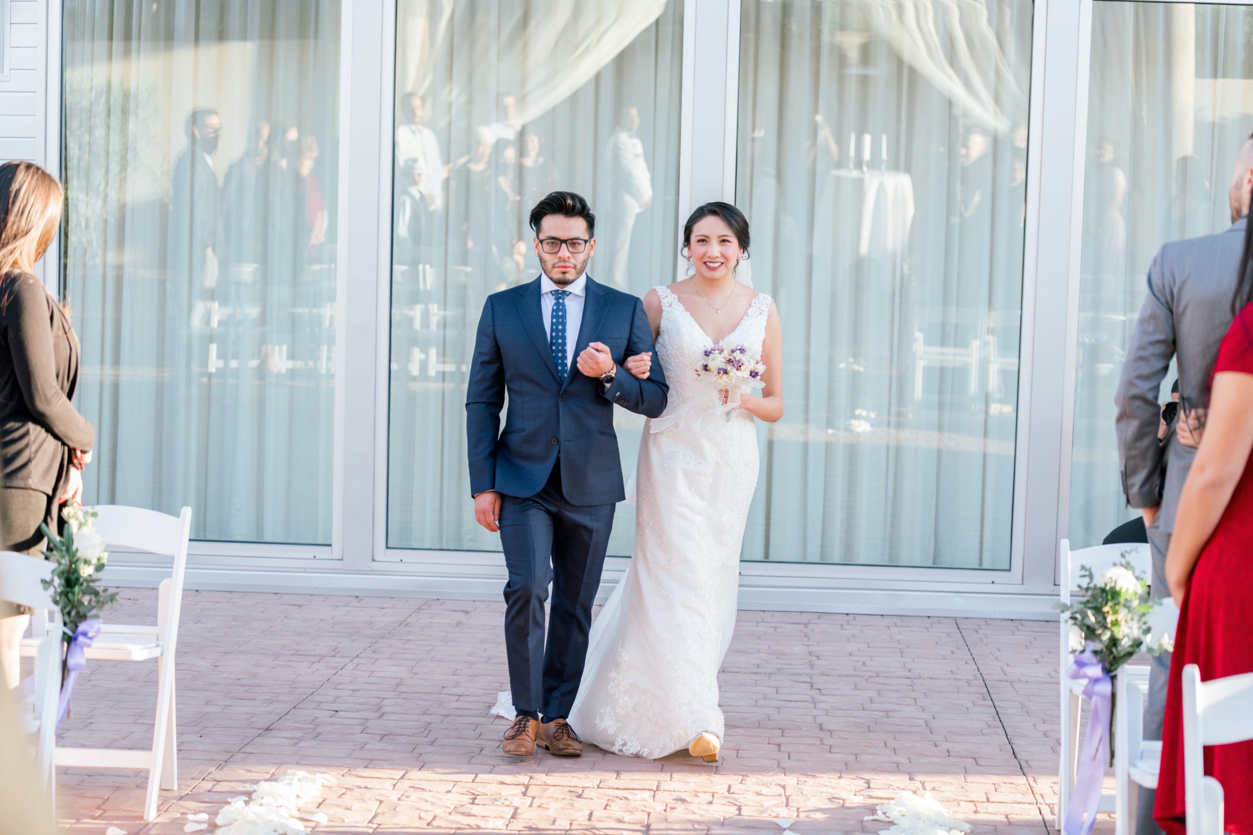 Luis at his wedding walking down the aisle