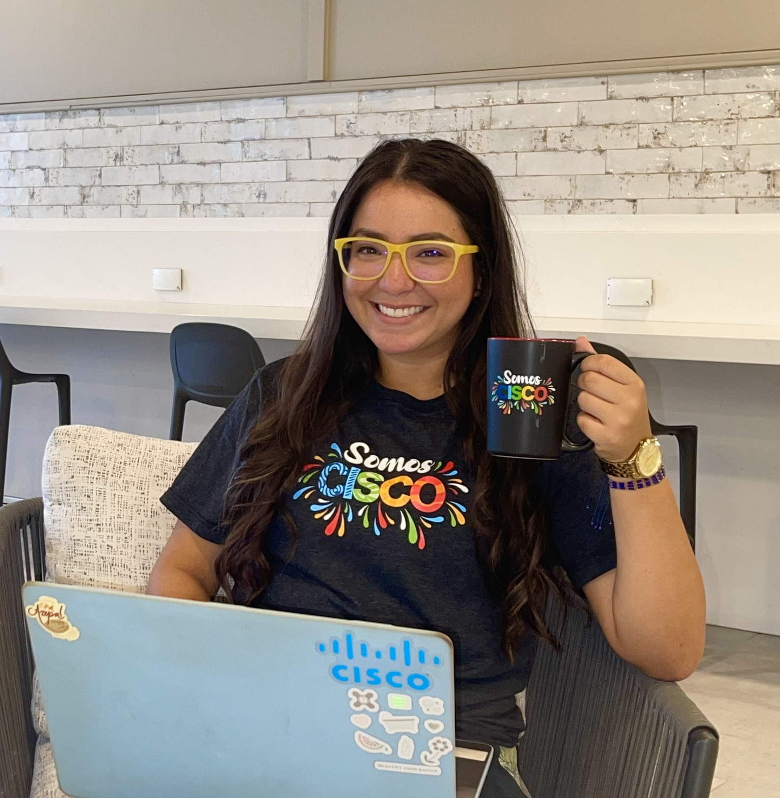 Sabrina wears the Hispanic Heritage Month Collection that reads Somos Cisco.