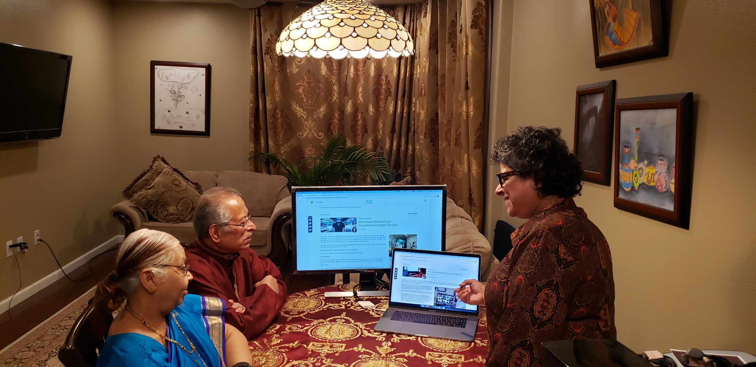 Rashmi showing her parents her previous blog.