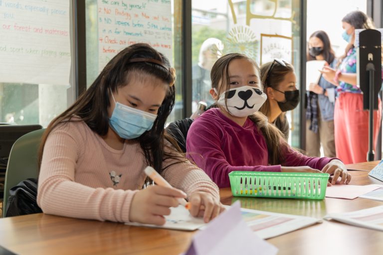 Children wearing masks in a school