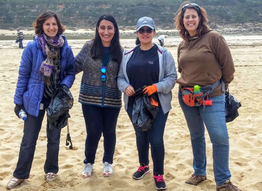 Cisco employees at a beach clean-up