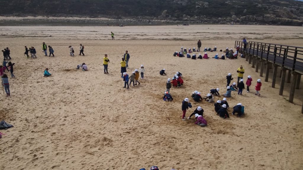 Children cleaning up a beach