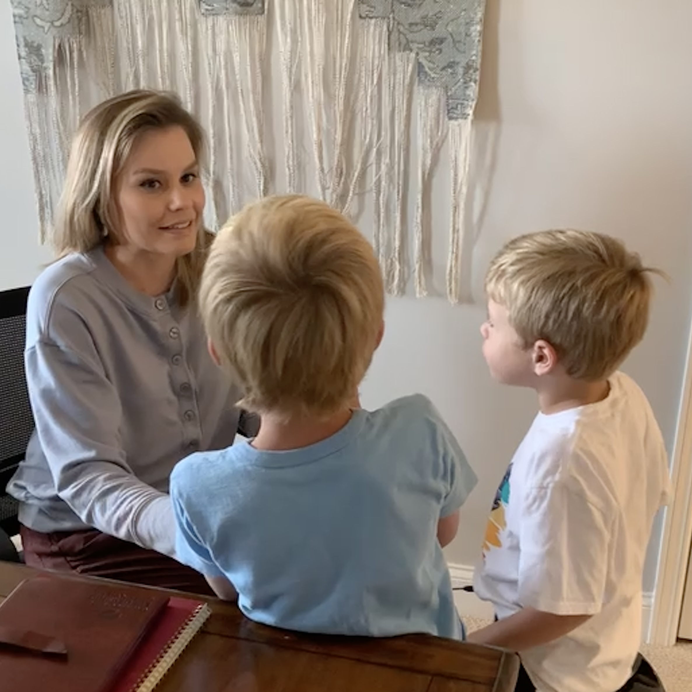 Crystal talking with her two young boys.