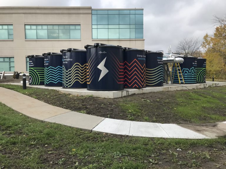 Black ice storage tanks on a corporate campus