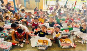 children from Atea Children's Home with their Christmas gift baskets