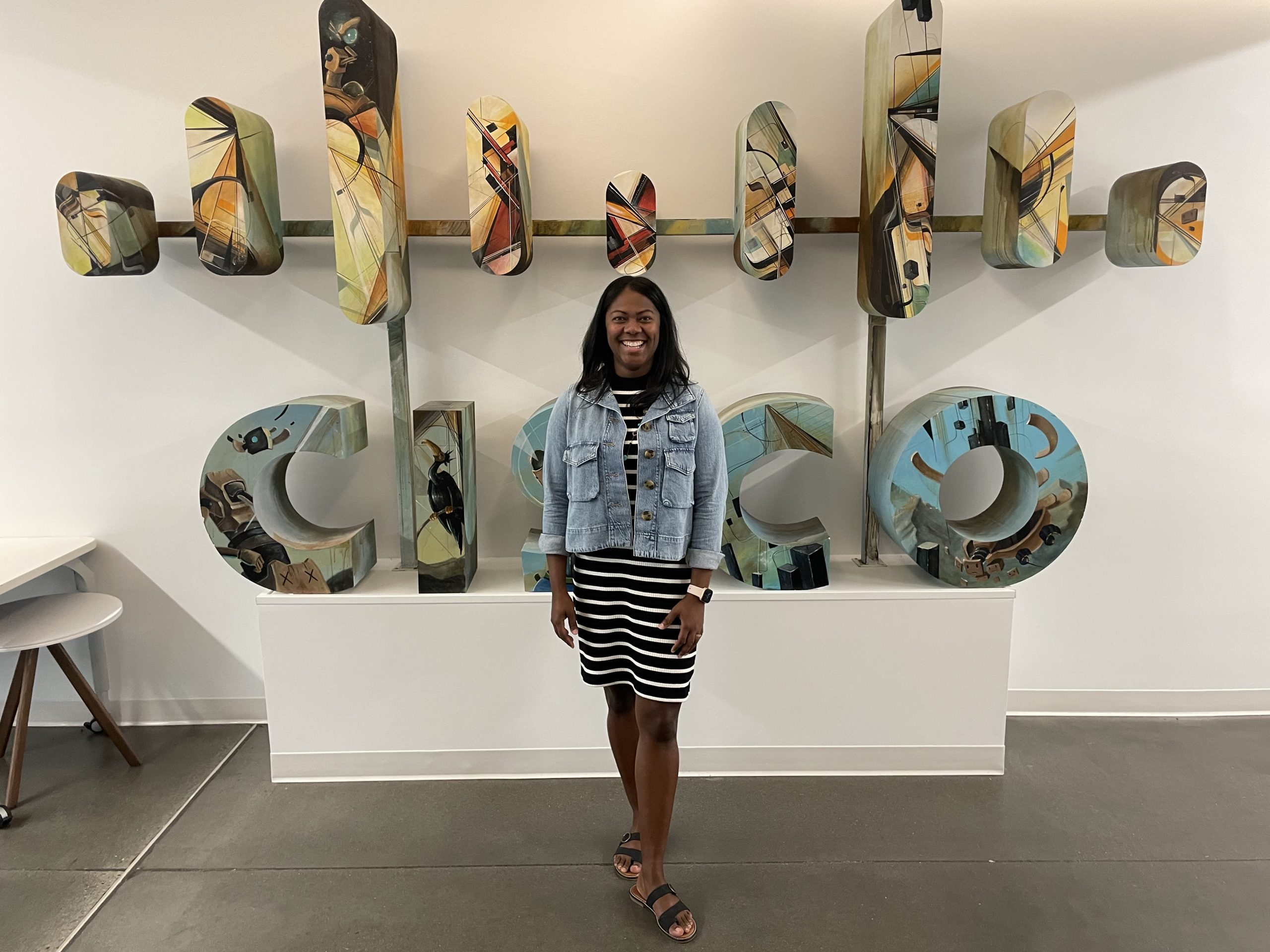 Janene standing in front of a Cisco sign