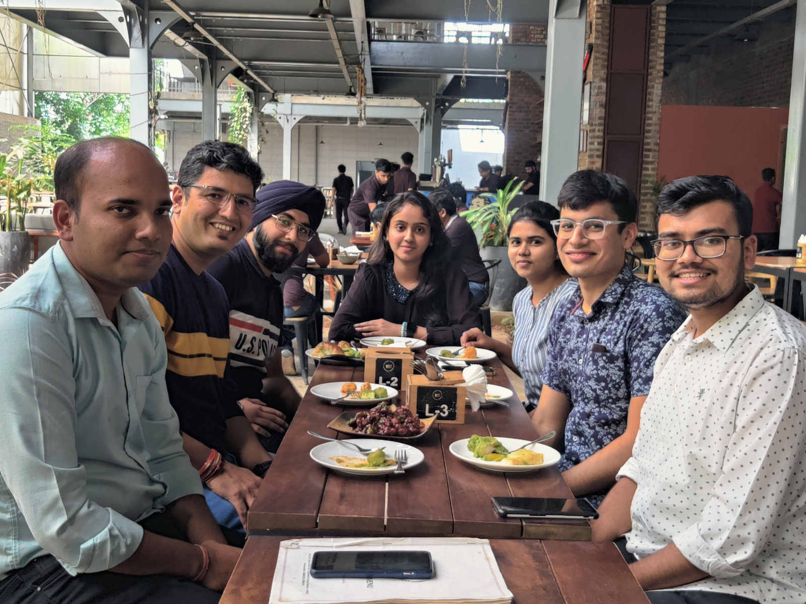 Tanishq at a restaurant with colleagues. 