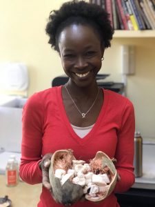 Kiva U.S. borrower and small business owner, Renee holding products in her hands