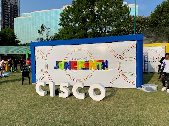 Cisco sighn and banner at the Juneteenth Atlanta Parade and Music Festival 2024