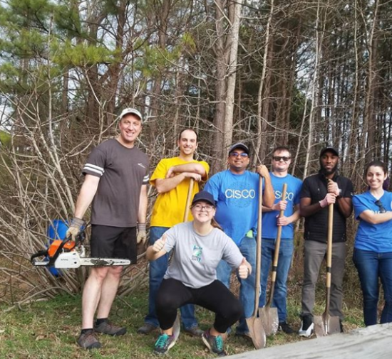 Chloe with her team at a give back event.