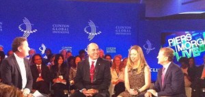 Cisco Chairman and CEO John Chambers (right) participates in a panel discussion on "mobilizing youth" at the CGI annual meeting on September 25. 