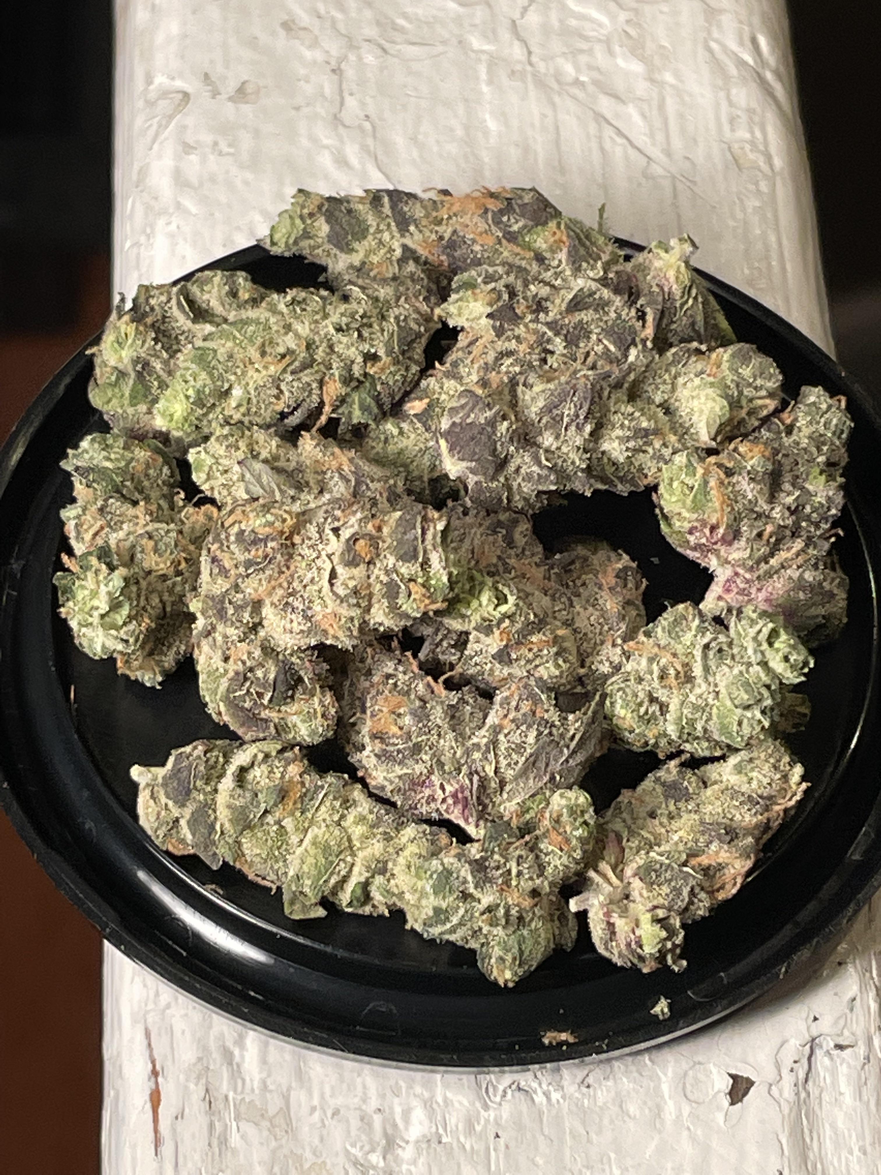 Chem Rider indica-leaning hybrid cannabis strain with dense frosty buds and 26 percent THC