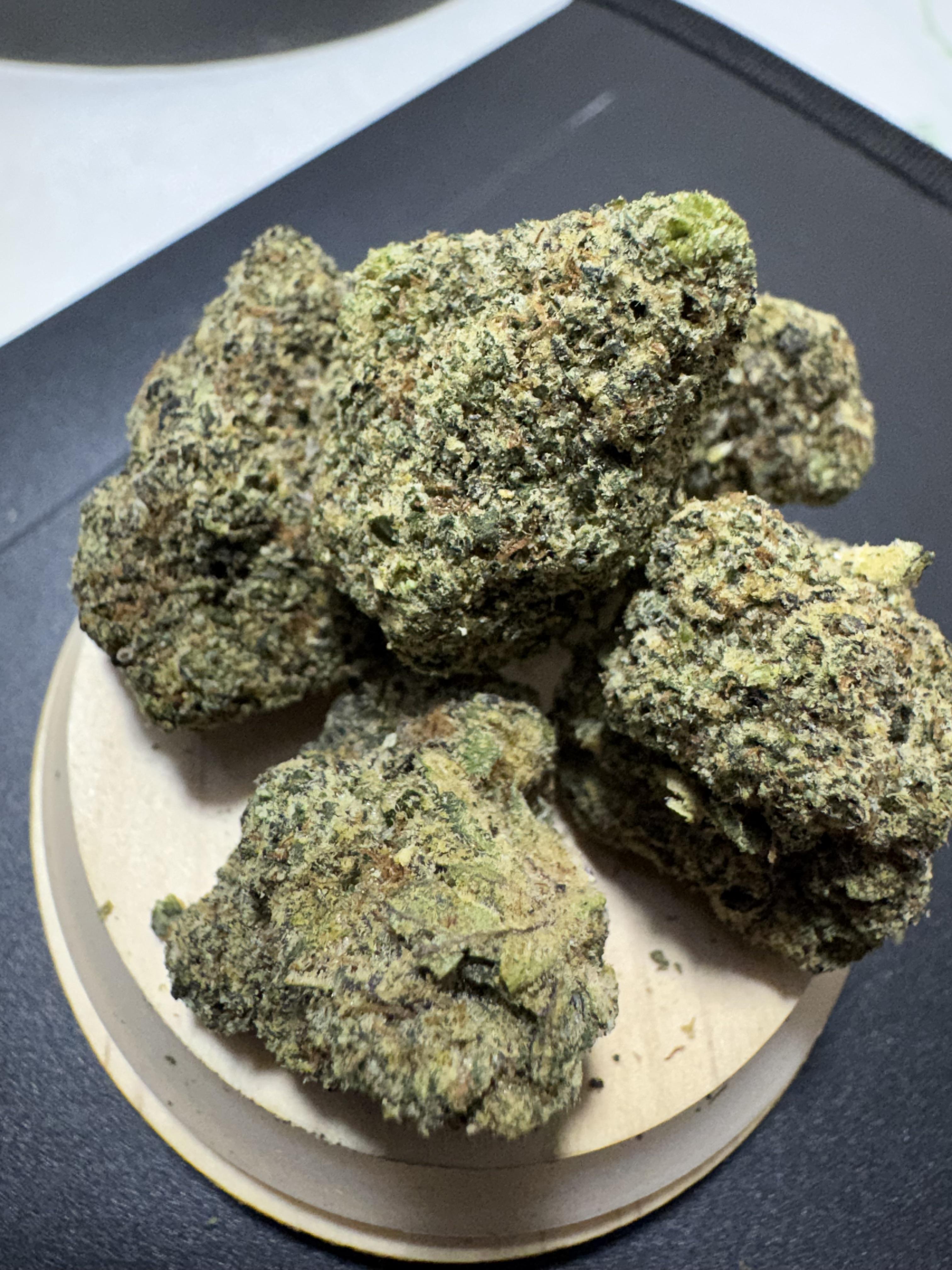 ZO2 cannabis strain buds with purple hues and 26 percent THC displayed in a modern urban style