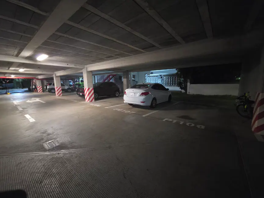 Covered parking garage with numbered stalls on premises