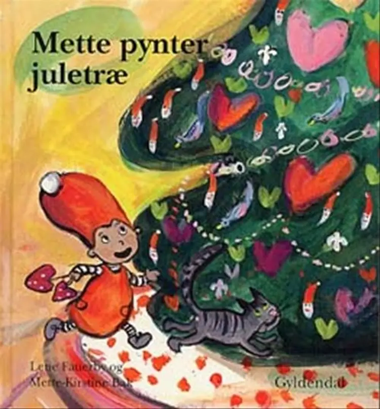 Mette pynter juletræ af Lene Fauerby