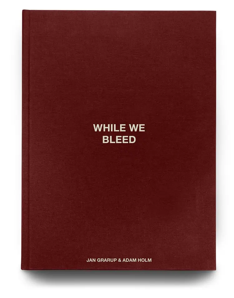 WHILE WE BLEED - Dansk udgave af Adam Holm