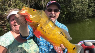 Man with peacock bass in South Florida