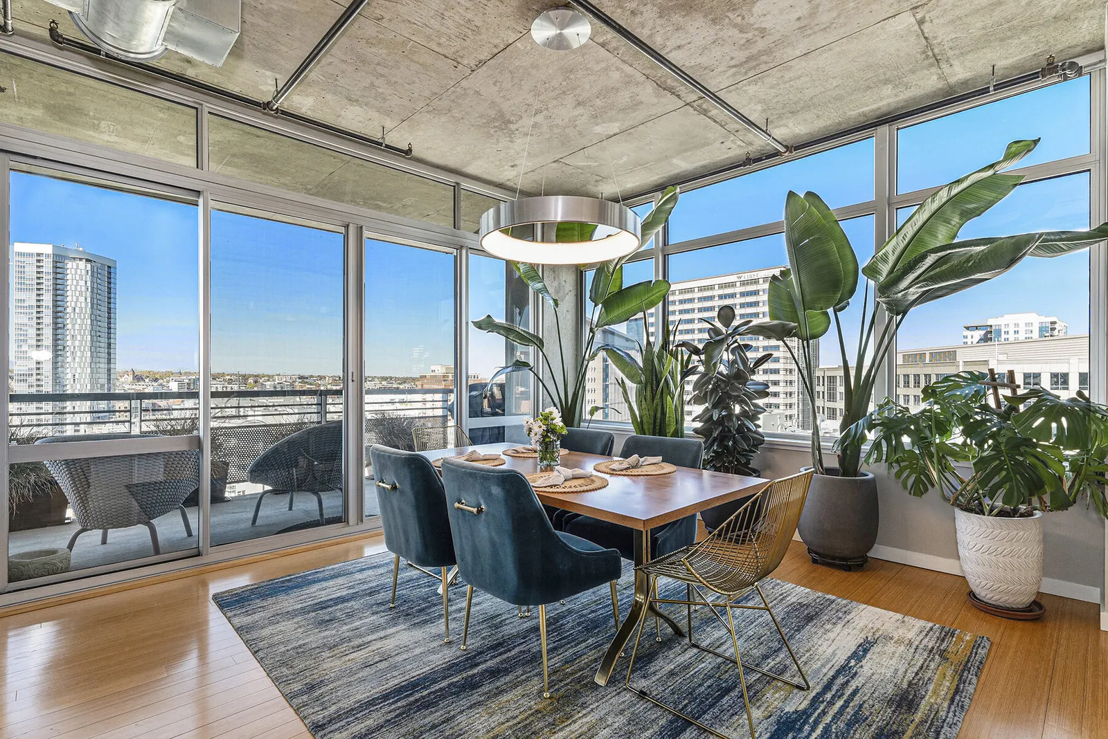 A bright loft dining room with downtown Denver views