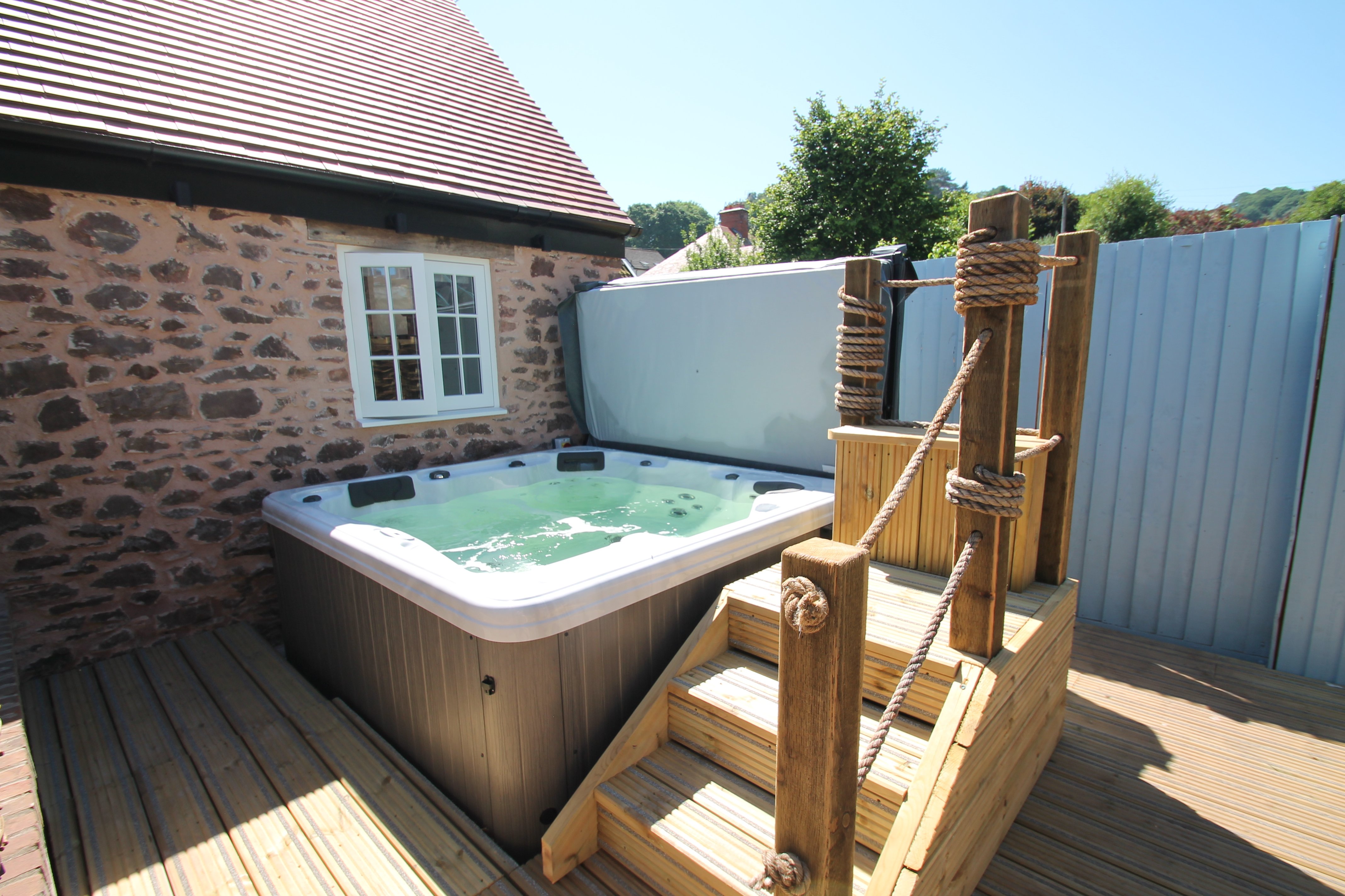 The hot tub is right outside the front door