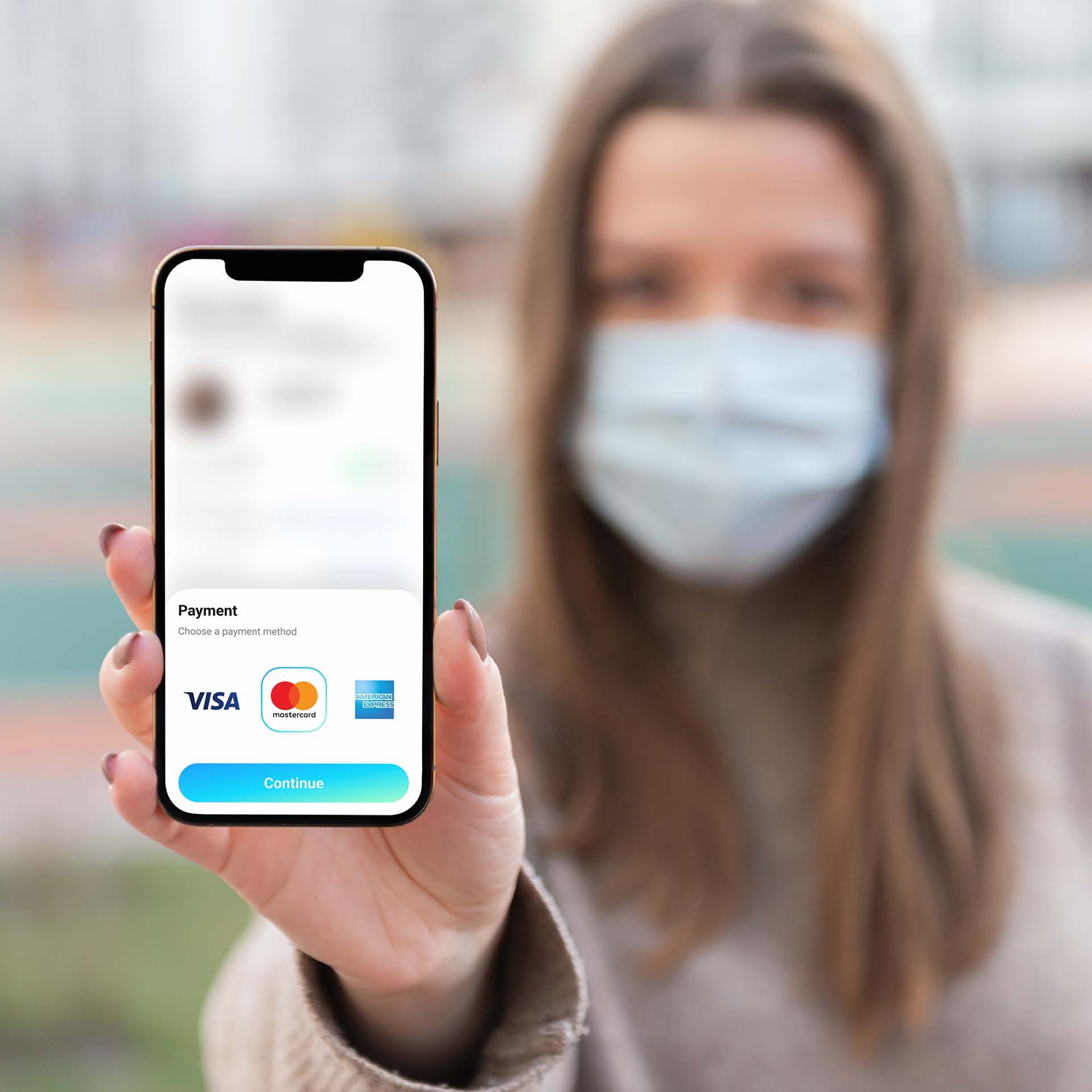 Our end user holding a smartphone shows how easy and convenient online payments are for everyone.