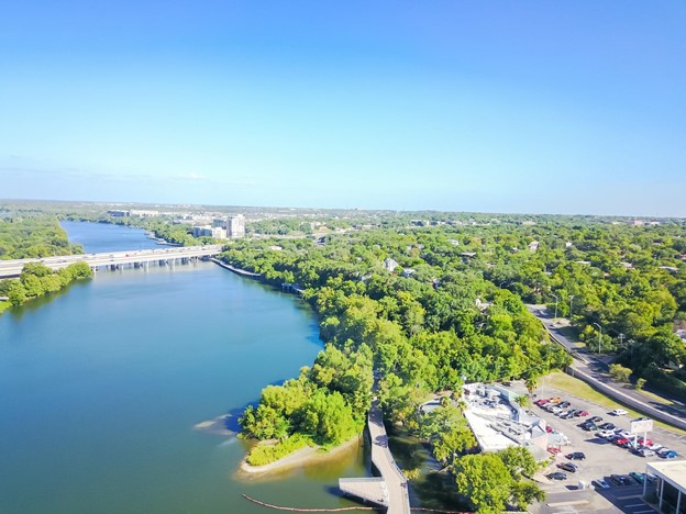 An aerial view of Lady Bird Lake and the Colorado River as they meet downtown Austin, TX.