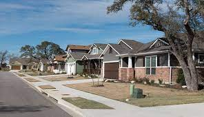 A family in front of a house in Liberty Hill, TX