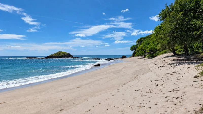 Soft white sand beach at bottom of direct path from garden, under a minute walk